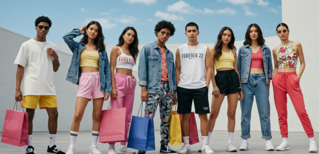 A stylish group of diverse young adults in their late teens to mid-twenties posing confidently in a bright, modern urban setting